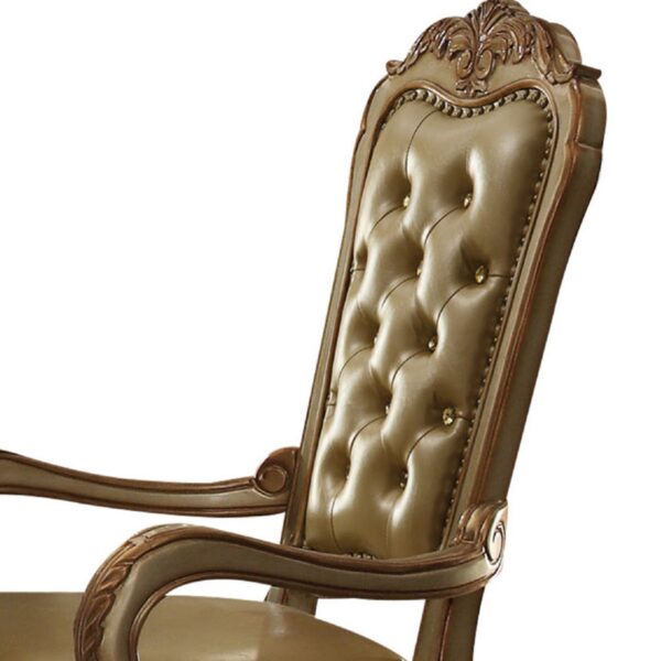 1502202669913fc2cd0d5.jpeg Leatherette Upholstered Arm Chair with Intricate Carvings, Set of 2, Gold