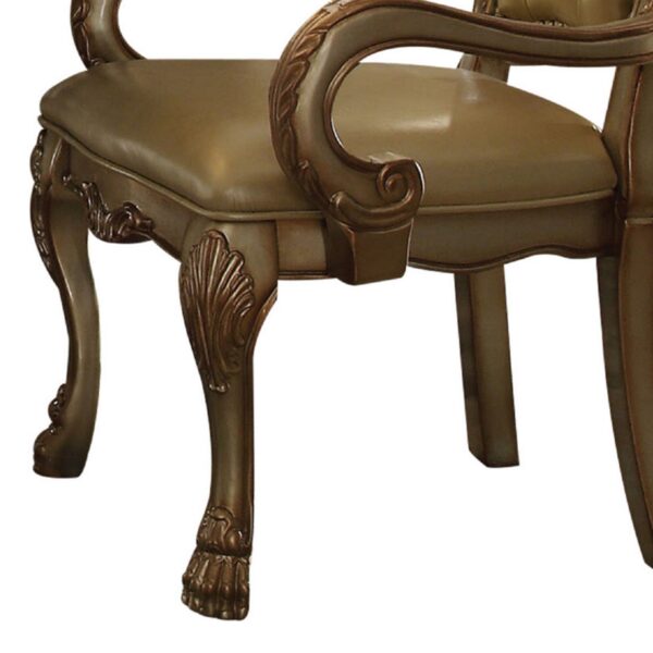 1502202669913fc9ac880.jpeg Leatherette Upholstered Arm Chair with Intricate Carvings, Set of 2, Gold