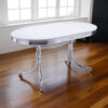 Loy 60 Inch Oval Dining Table, Glossy White Wood Top, Ribbed Chrome Apron