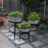 UPT-271316_13_13402f98-510c-4933-930b-50a4ed0e6996 21, 18, and 16 Inch 3 Piece Round Tub Metal Planter Set with Stand in Galvanized Gray and Black Iron