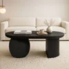 Uri 38 Inch Oval Coffee Table, Mango Wood Full and Half Spherical Leg, Sandblasted Black